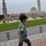 Musawwir Jaihoon heading to the Masjid — at Sultan Qaboos Grand Mosque.